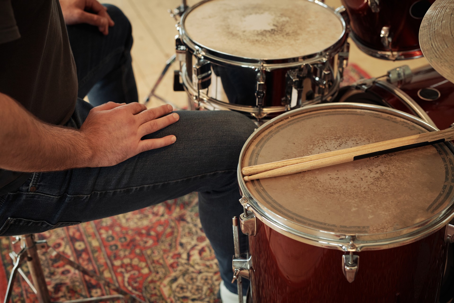 Drummer sitting at drums set