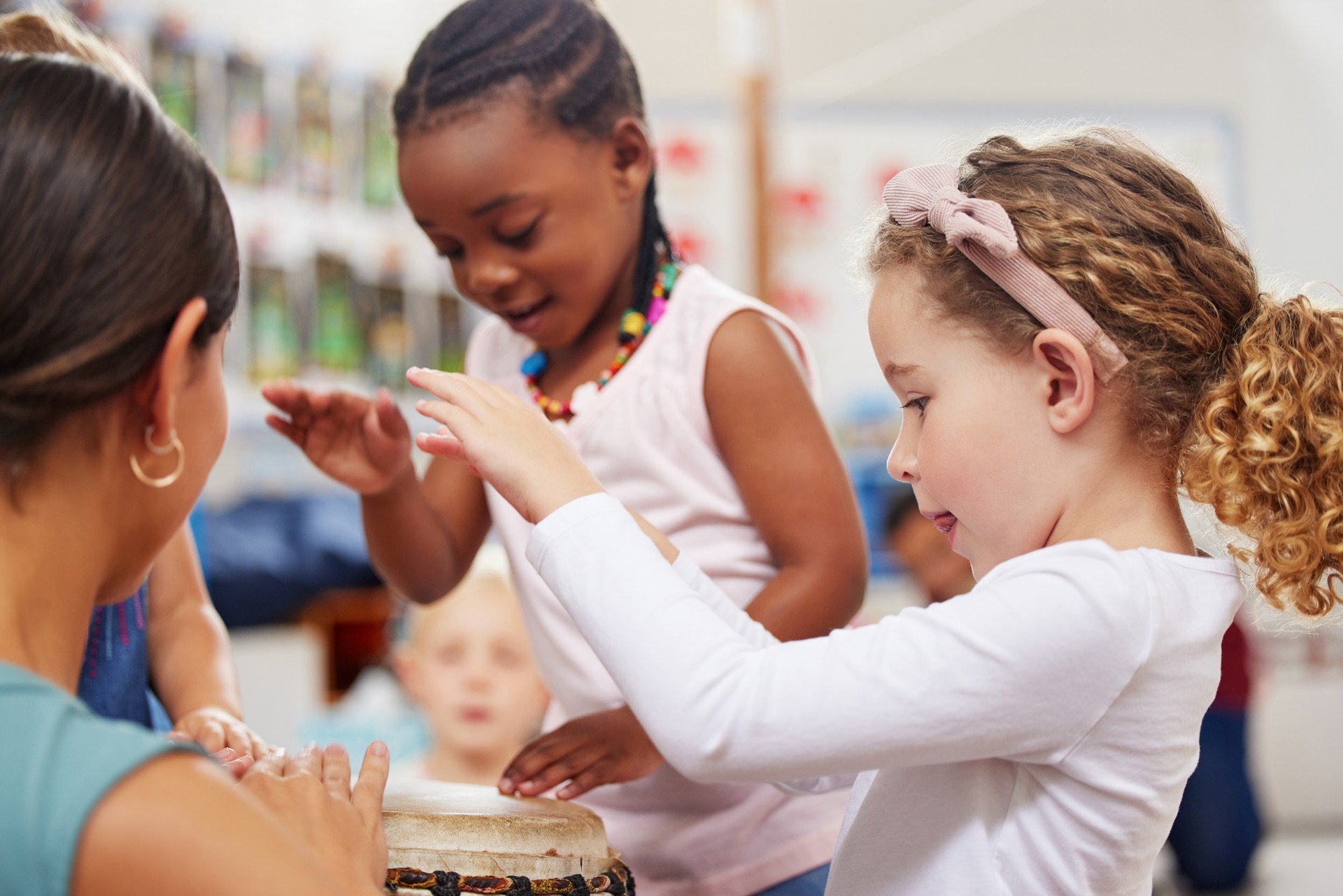 Shot of children learning about musical instruments in class